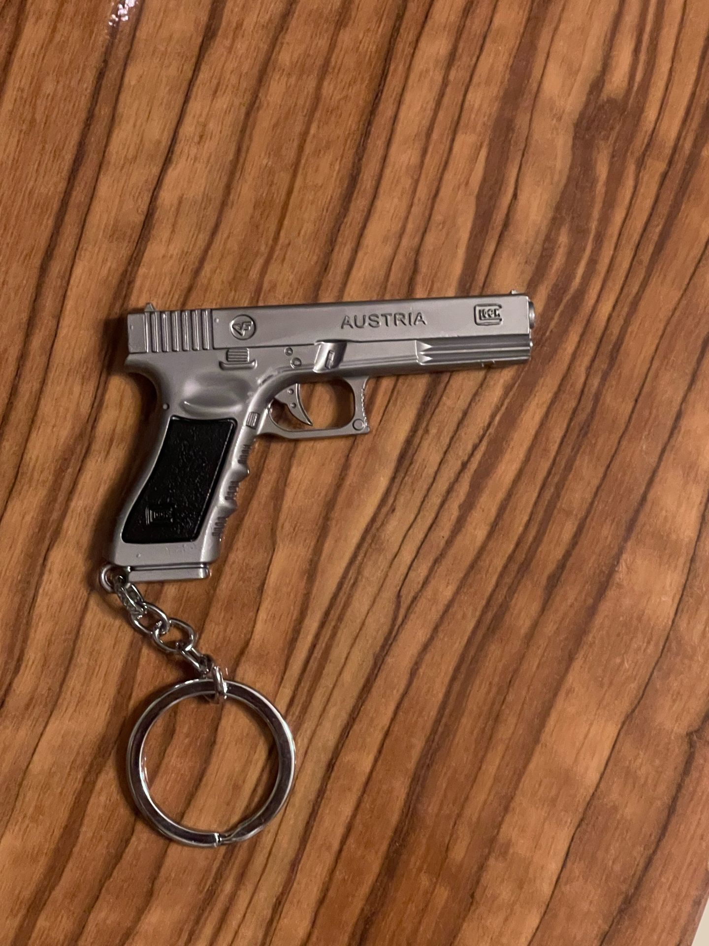 Metal pistol-shaped keychain