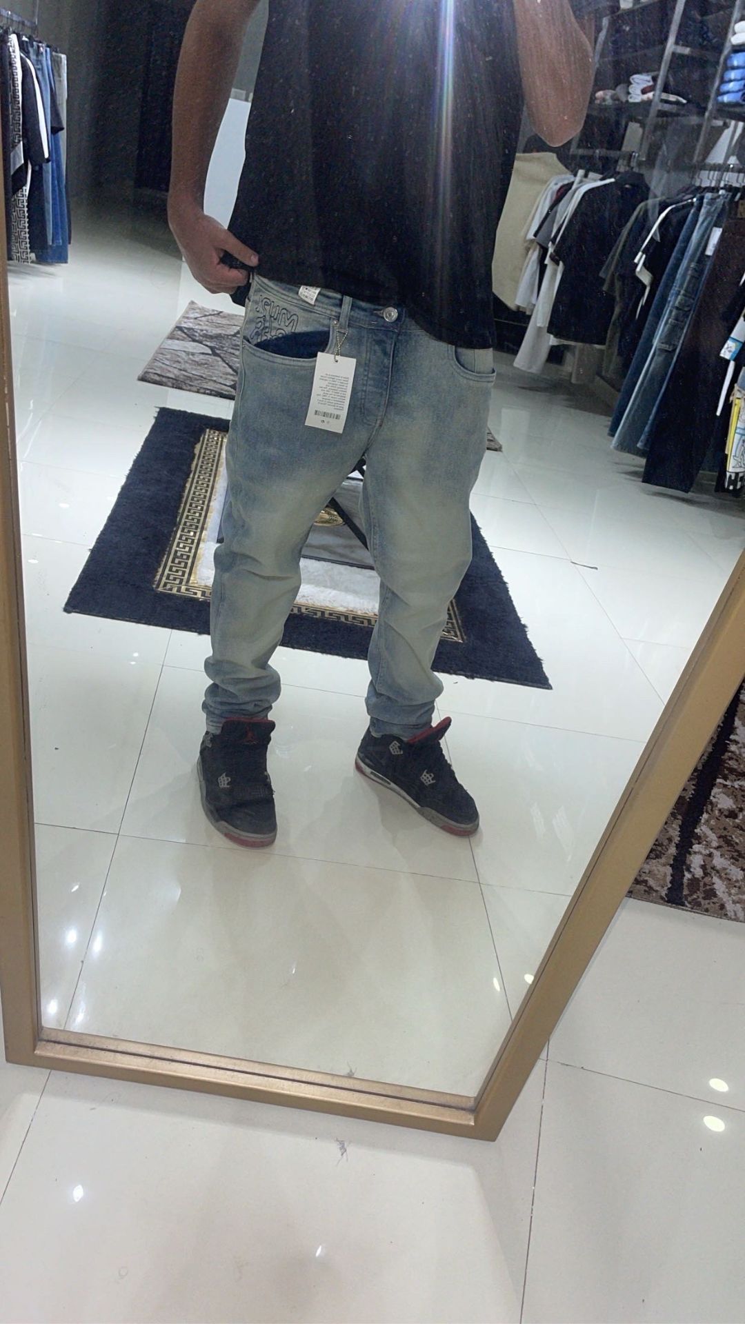 Light gray jeans with tag