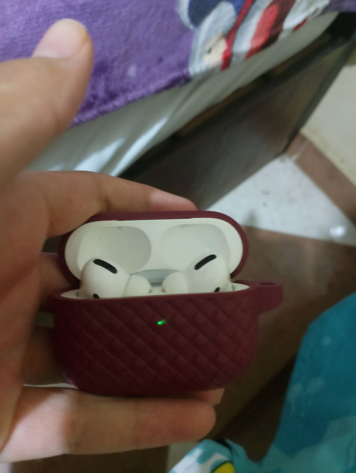 AirPods Pro in Maroon Case