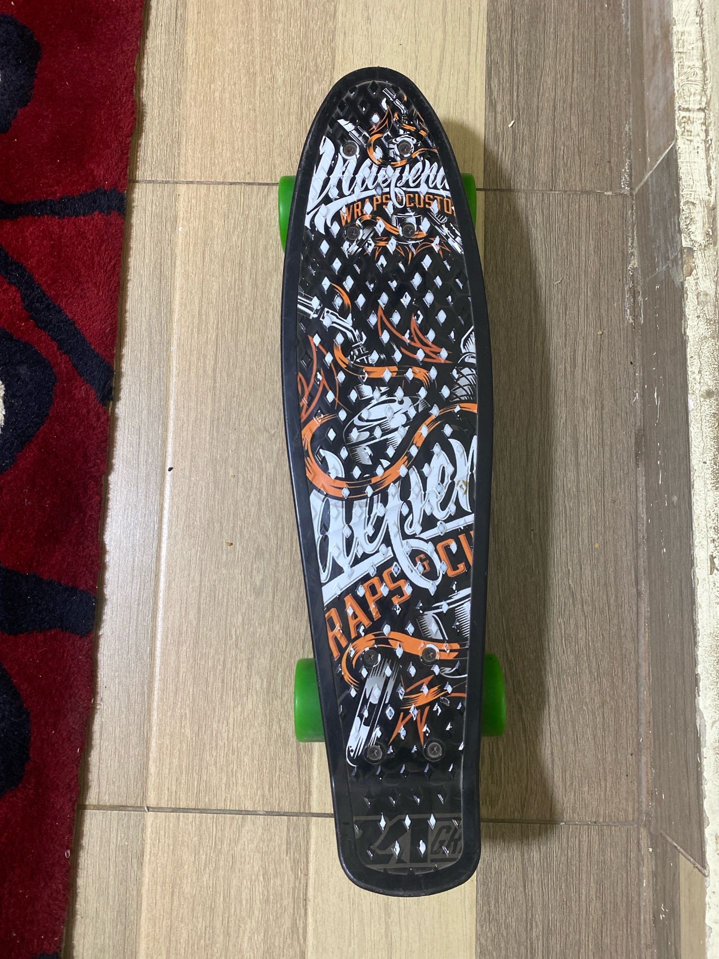 Skateboard with Green Wheels