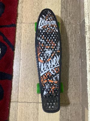 Skateboard with Green Wheels