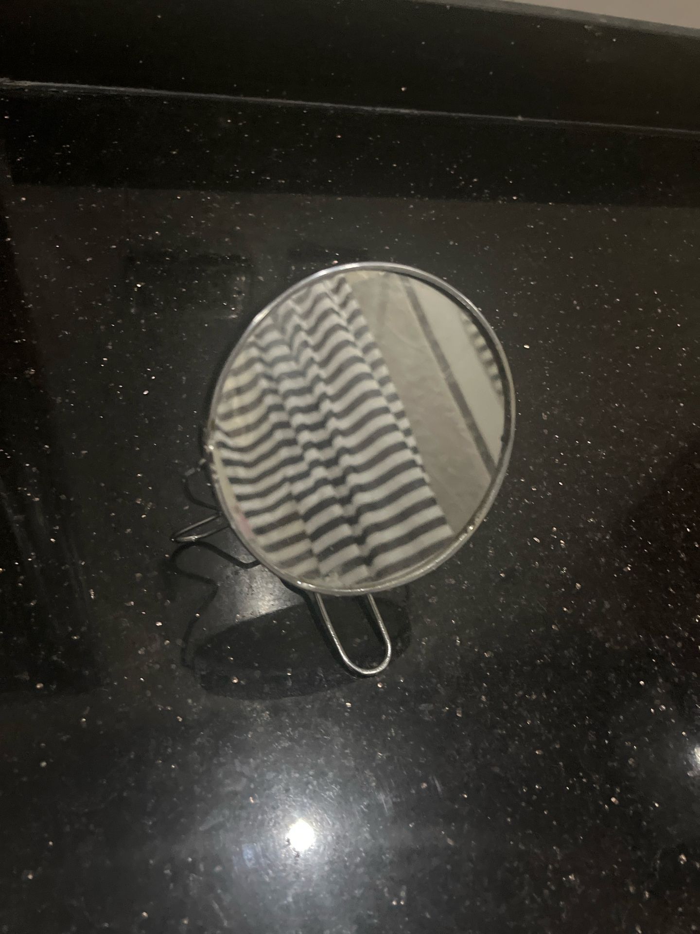 Handheld mirror with stand
