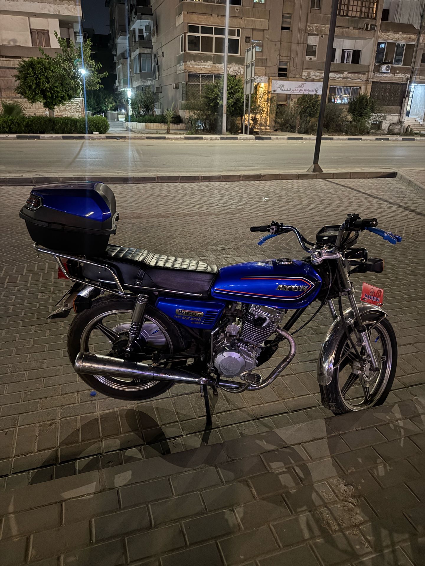 Blue Motorcycle with Trunk