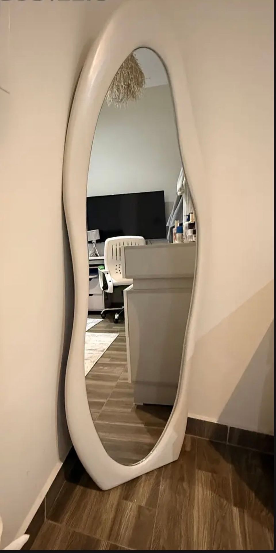 White oval standing mirror