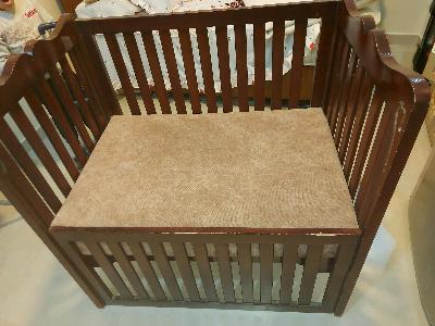 Brown wooden baby crib