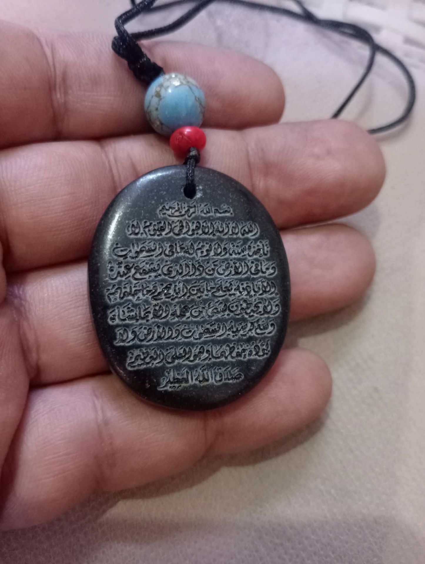 تميمة إسلامية بحبل أسود