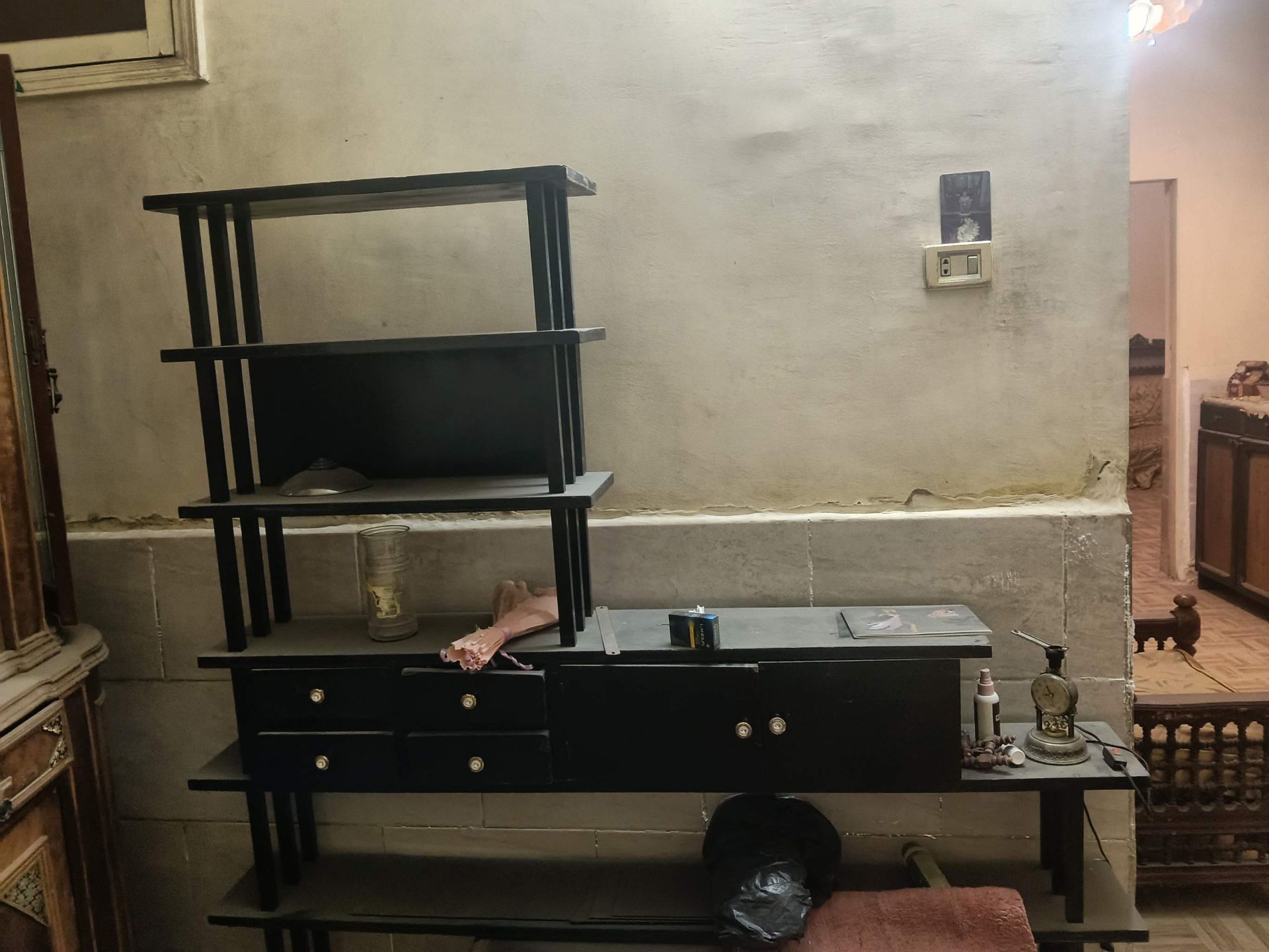Black shelving unit with drawers