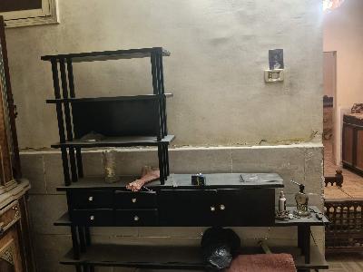 Black shelving unit with drawers