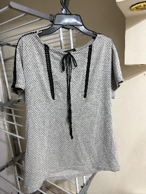 Polka dot blouse with lace trim